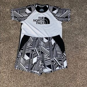 White/black designs The North Face shirt w/shorts.